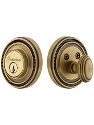 Grandeur Single-Cylinder Deadbolt with Soleil Plates Keyed Alike in Antique Brass.